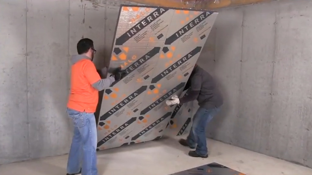male construction workers installing Halo® Interra® to concreate wall