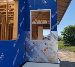 Halo Exterra being installed over a layer of weather barrier.